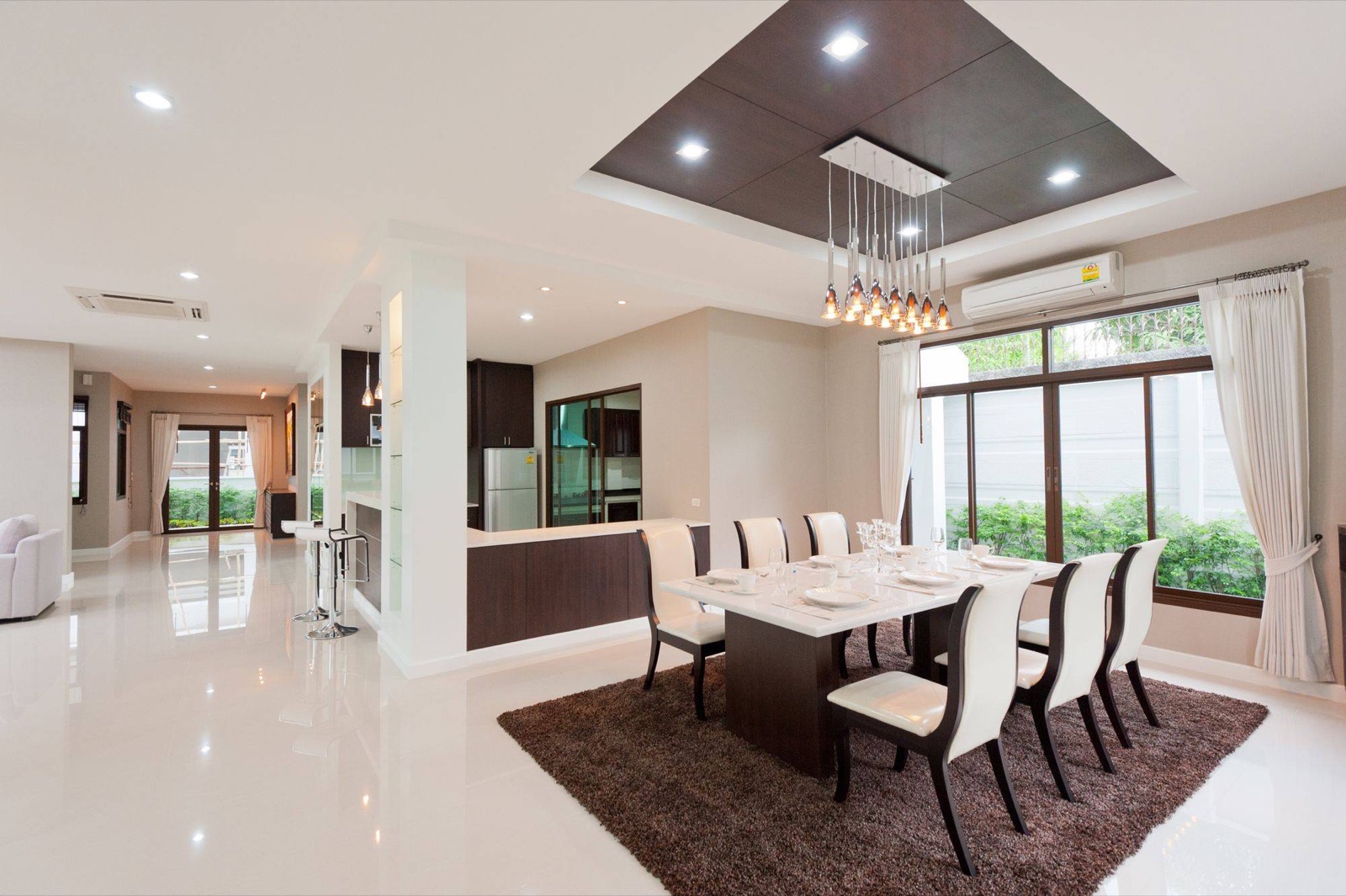 Clean open-plan dining room with garden view